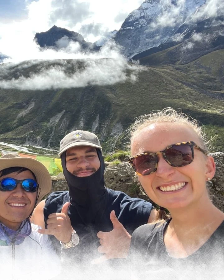 Close Group Selfie with Mountains