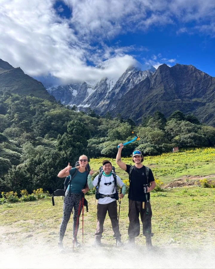 Group Photo with Peak Emerging from Clouds