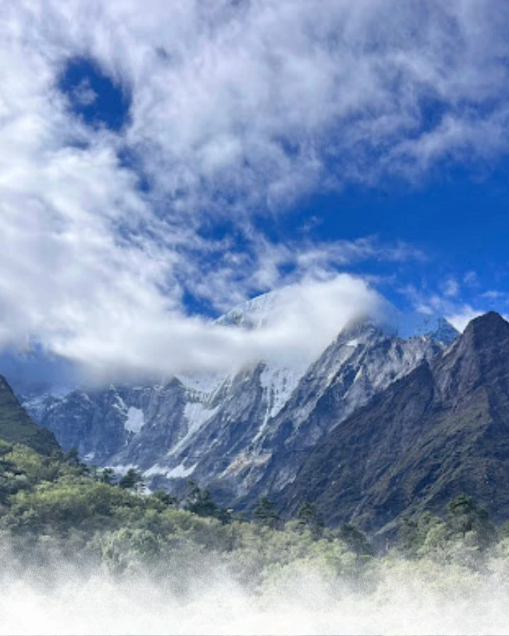 Peak Breaking through Clouds